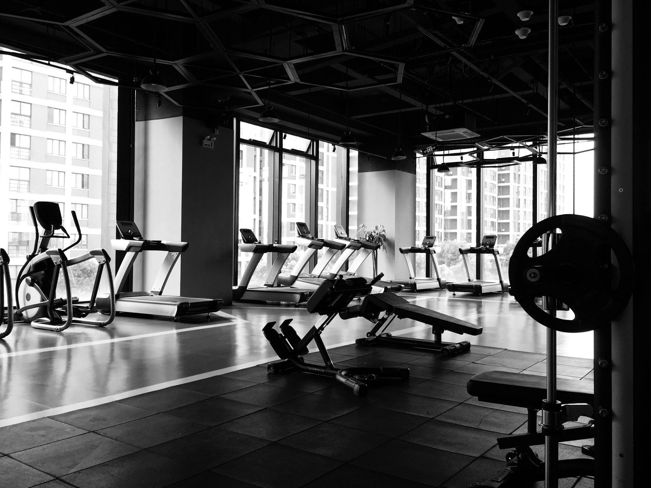 A modern, professional fitness facility equipped with specialized machines for supervised medical rehabilitation.
