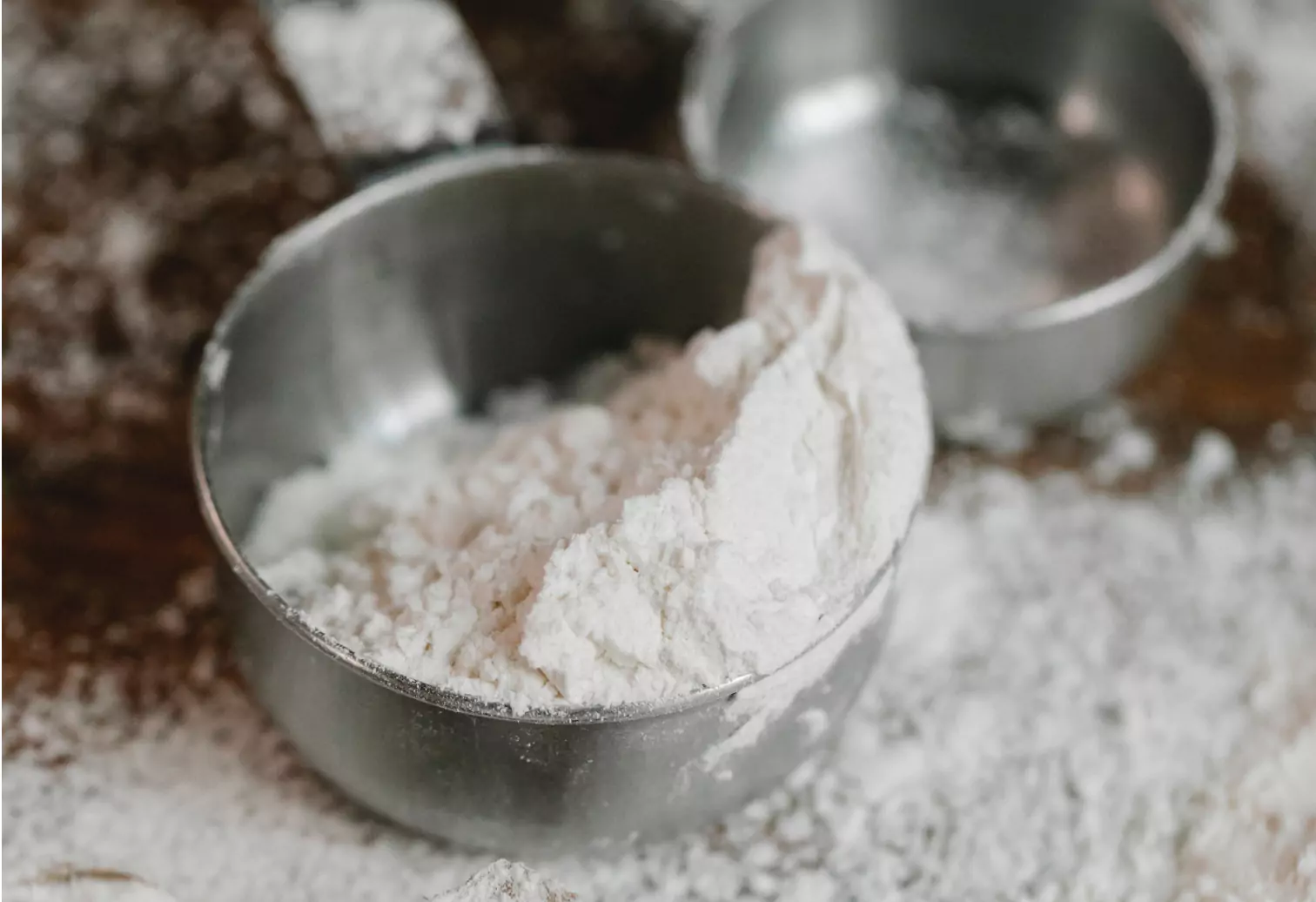 A wooden scoop filled with protein powder, illustrating a focus on macronutrient density.