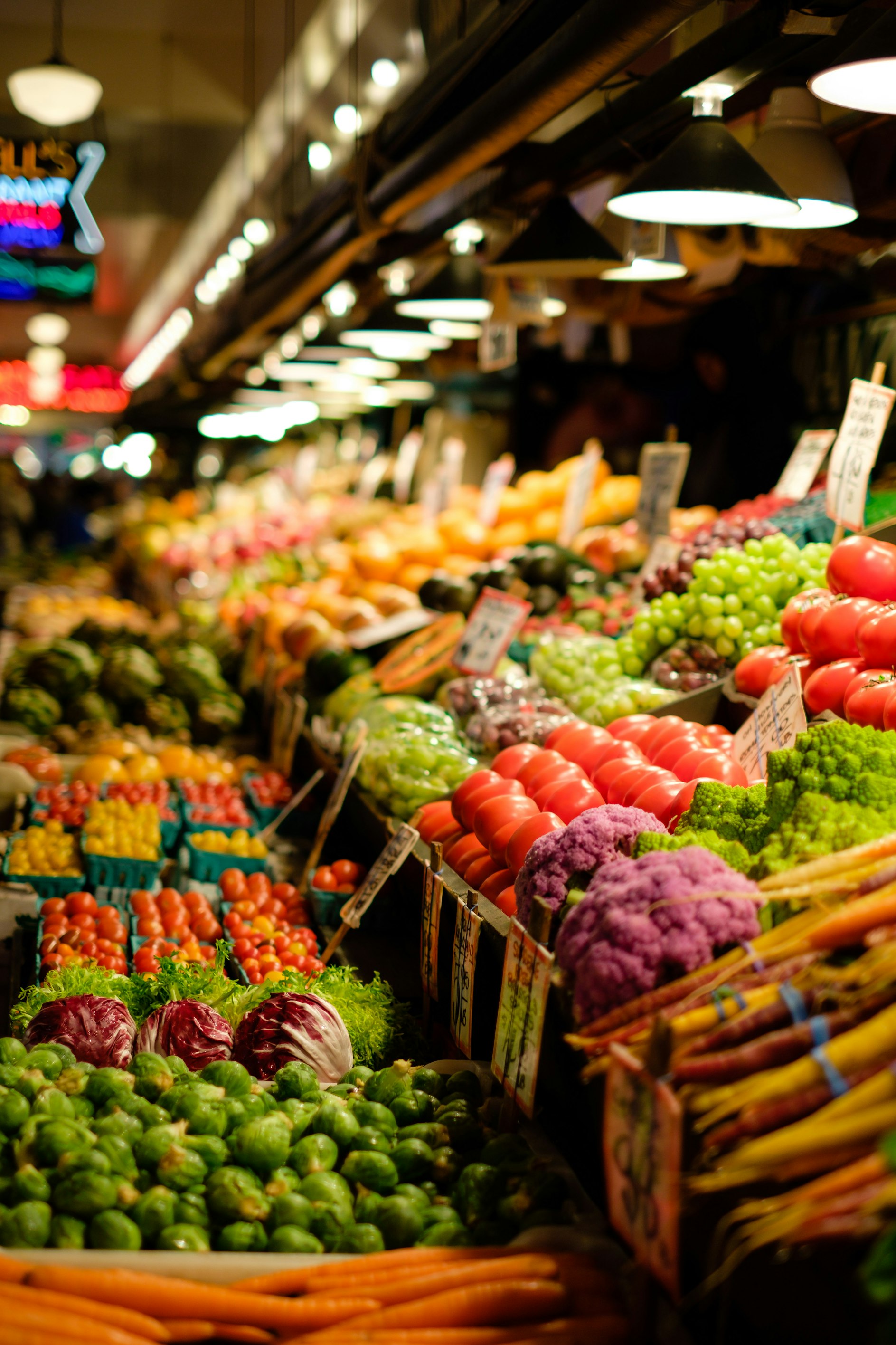 A flat lay of various high-fiber fruits and vegetables including berries, broccoli, and apples.