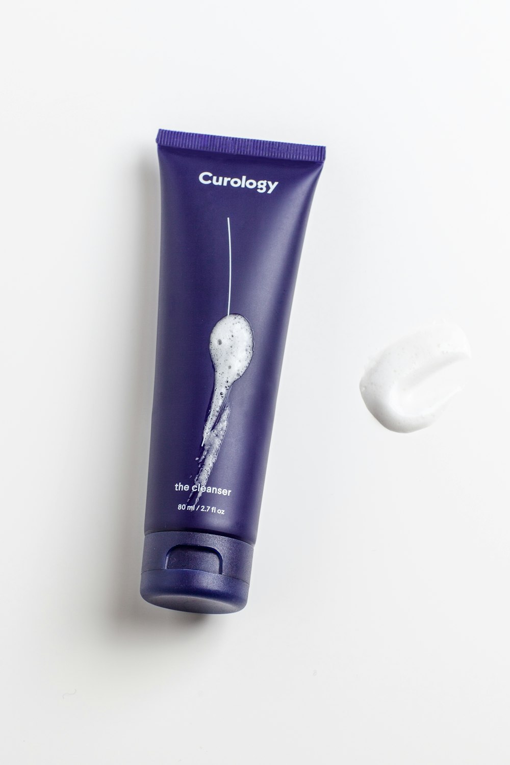 A variety of cosmetic and personal care products including lotions and shampoos displayed together.
