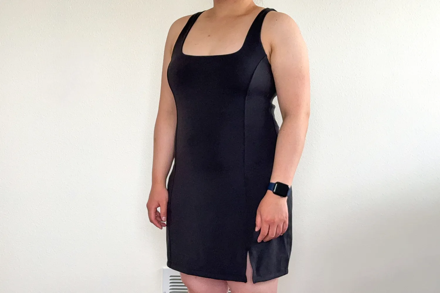 Front view of a person wearing a supportive, form-fitting lululemon exercise dress.