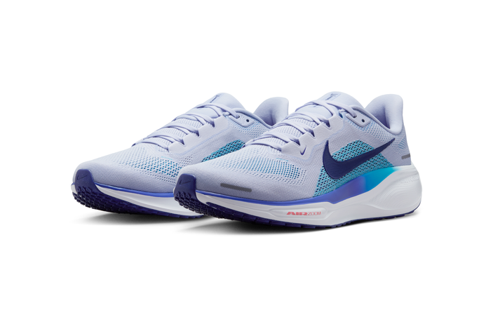 A pair of white Nike Pegasus 41 daily training shoes.