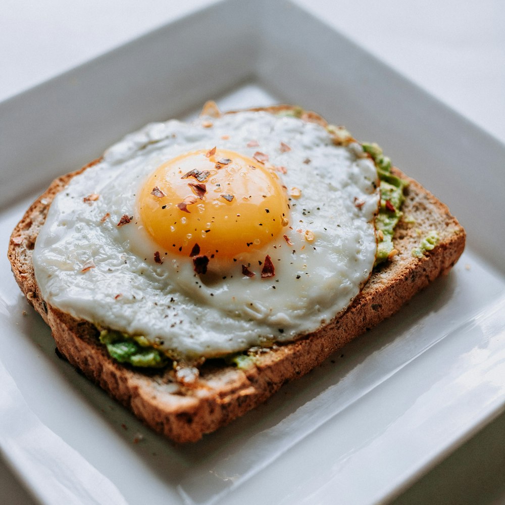 Close-up of sliced hard-boiled eggs with vibrant yellow yolks.
