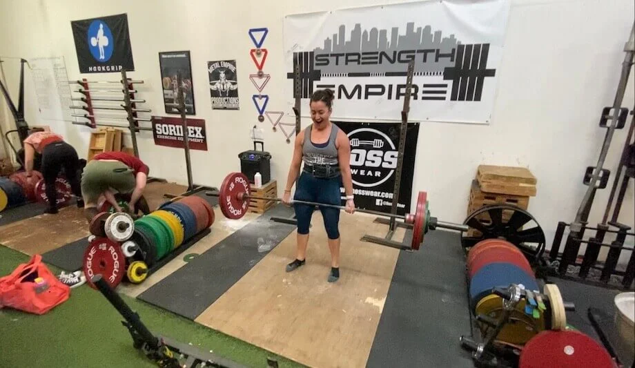 A person wearing sleek, high-waisted Lululemon leggings performing a workout.
