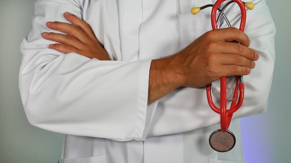 A medical stethoscope and a clipboard with health charts indicating a patient evaluation.