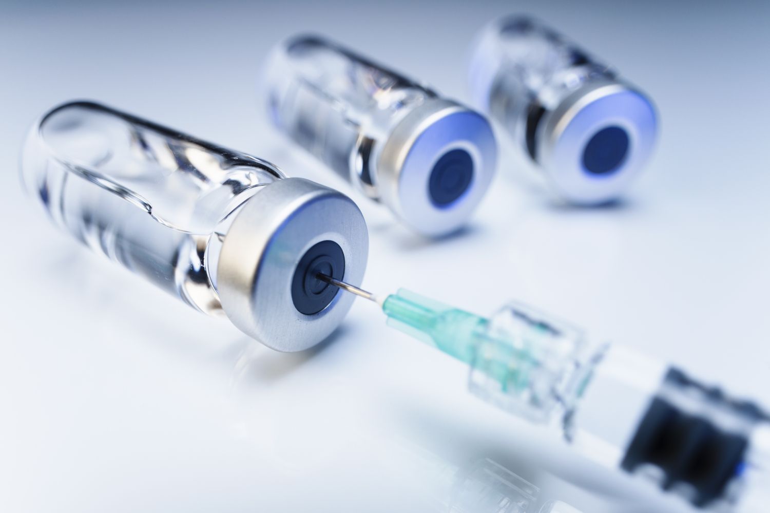Medical vials and a syringe representing the risks of unregulated injectable supplements.