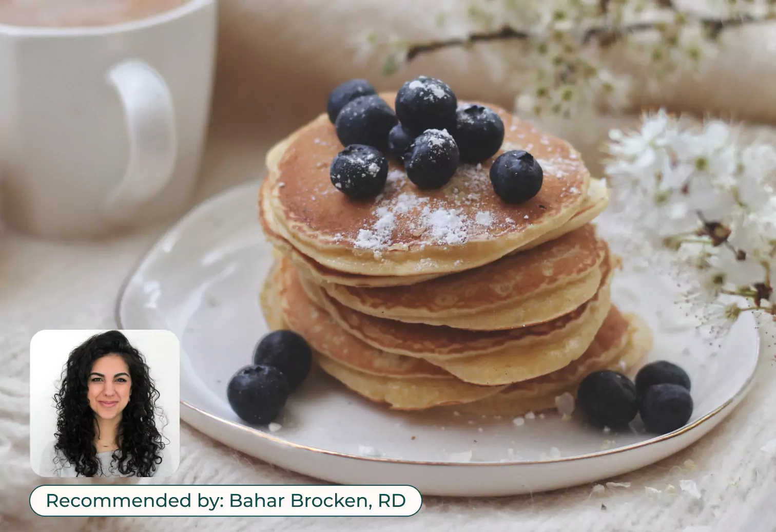 High-protein pancakes prepared with cottage cheese served on a white plate.