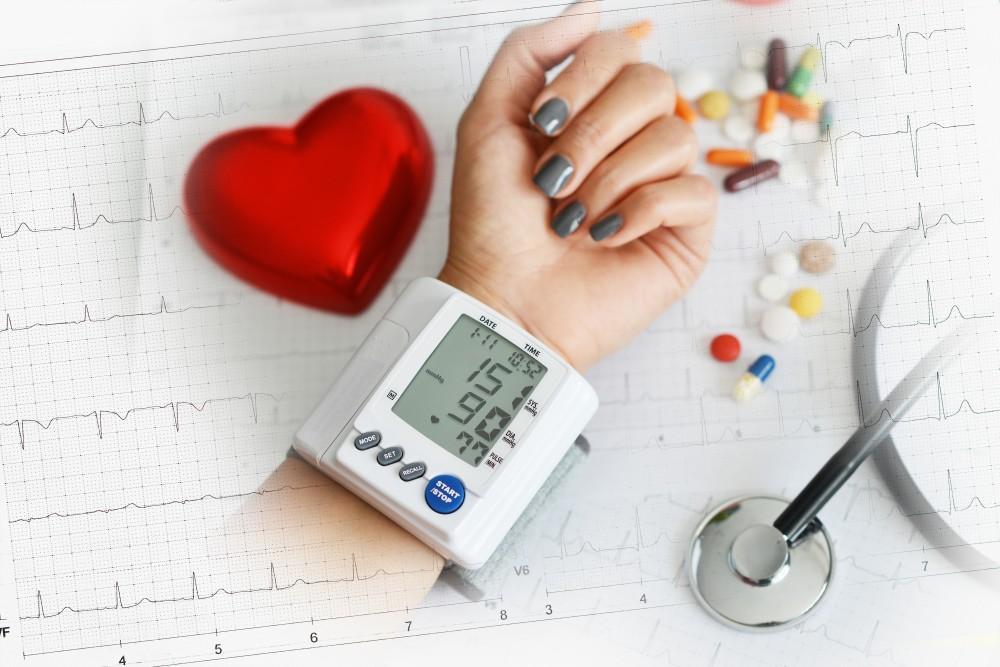A person looking stressed with an overlay of a heart icon.