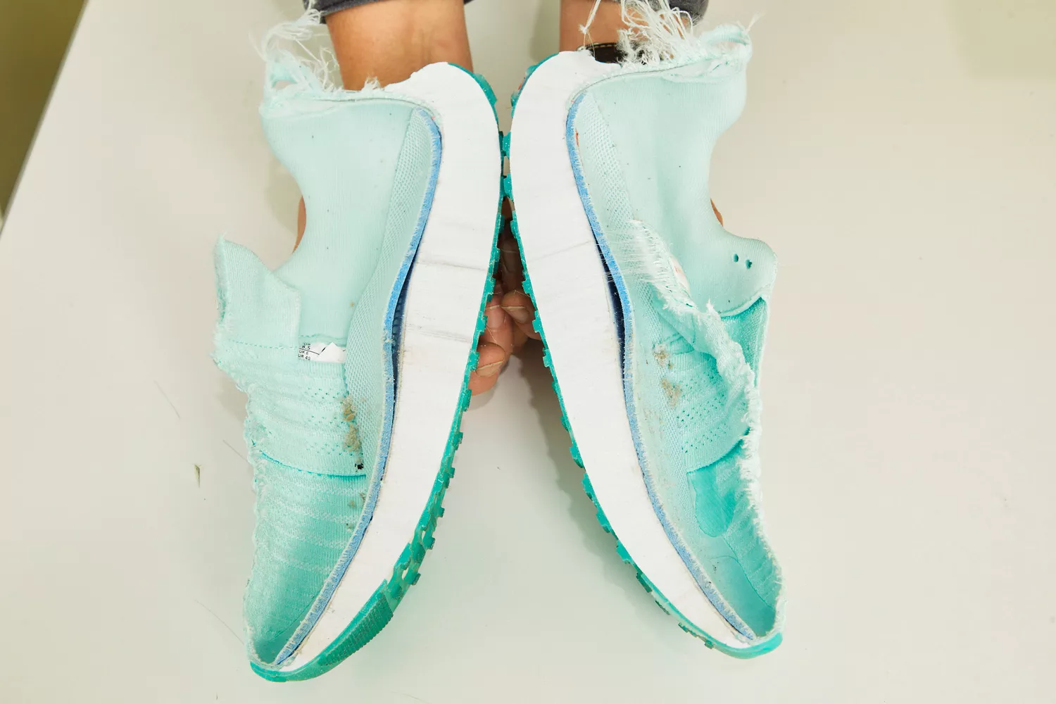 A Nike running shoe cut in half to show the internal foam layers and Zoom Air units.