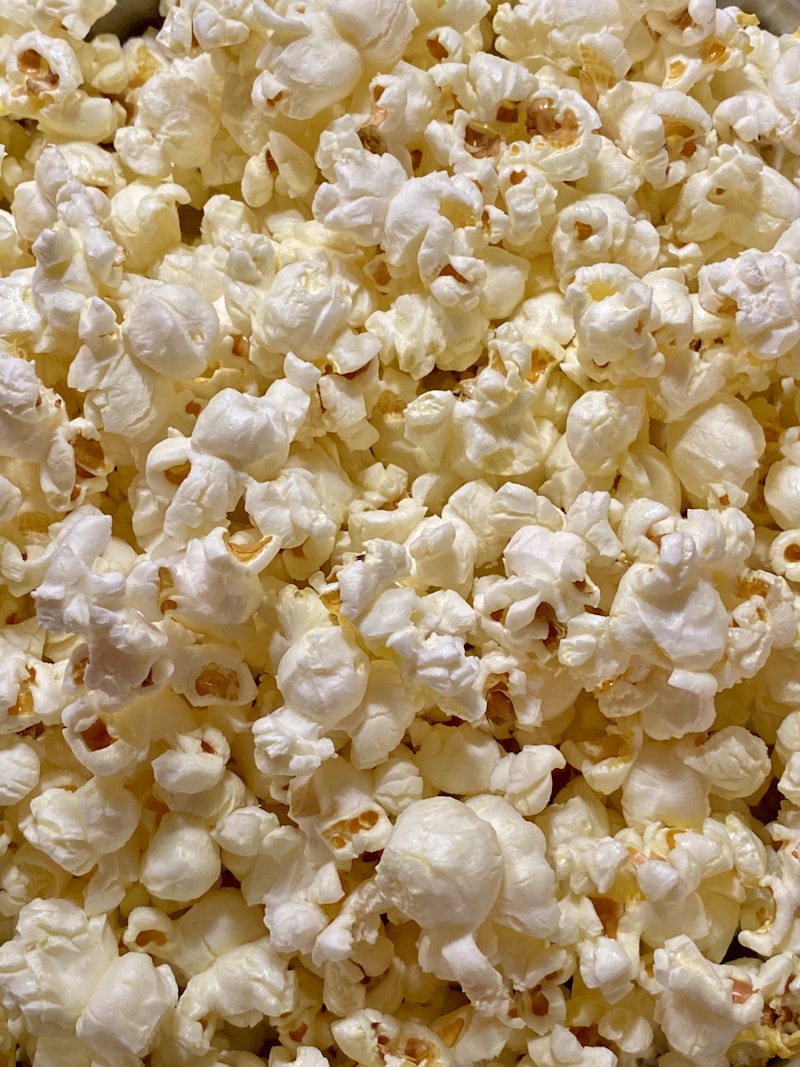 Light and fluffy air-popped popcorn served in a simple wooden bowl.