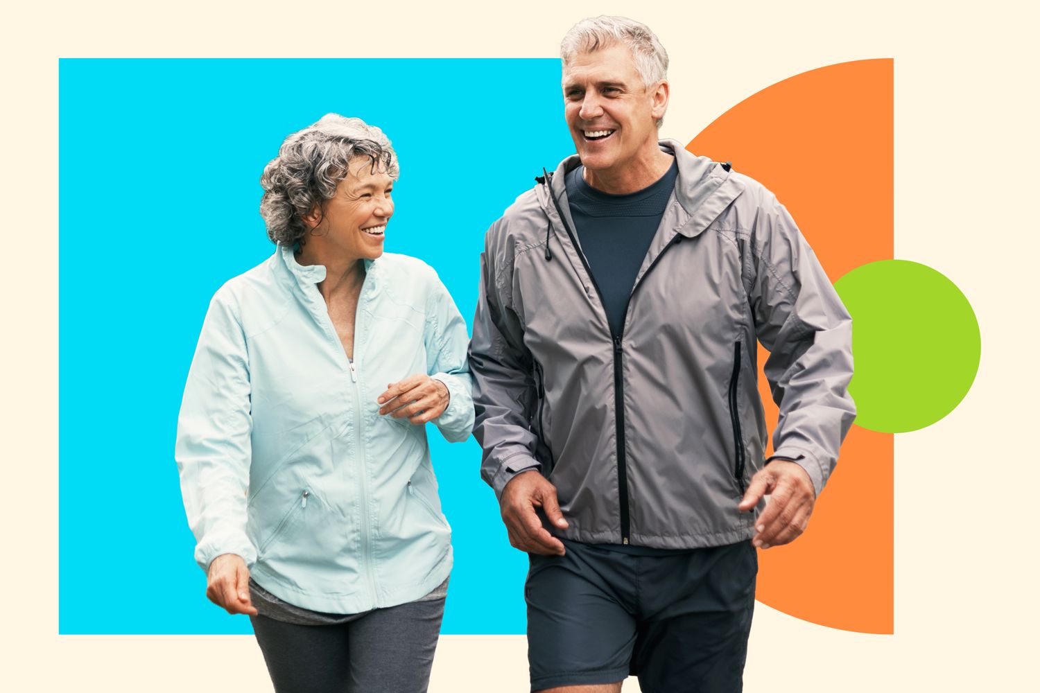 Two people engaged in a steady-paced walk outdoors on a paved path.
