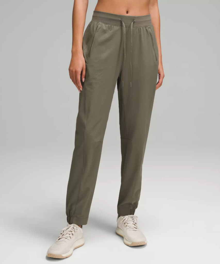 A pair of versatile high-rise khaki athletic pants suitable for workouts or errands.