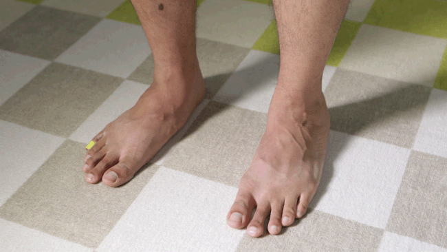 Side view of feet performing calf raises to strengthen arches and ankles.