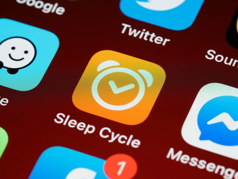 A person wearing a fitness tracker on their wrist while asleep.