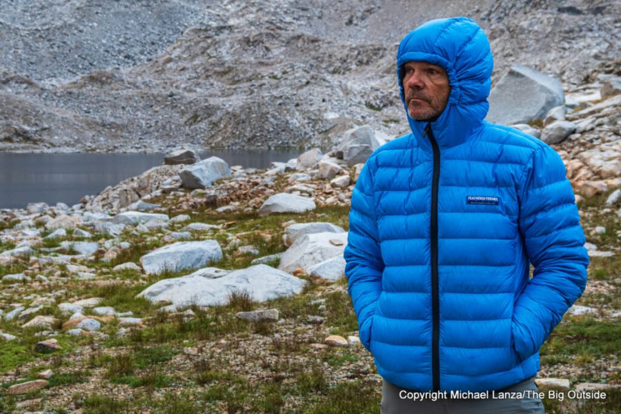 A lightweight insulated down jacket designed for outdoor warmth.