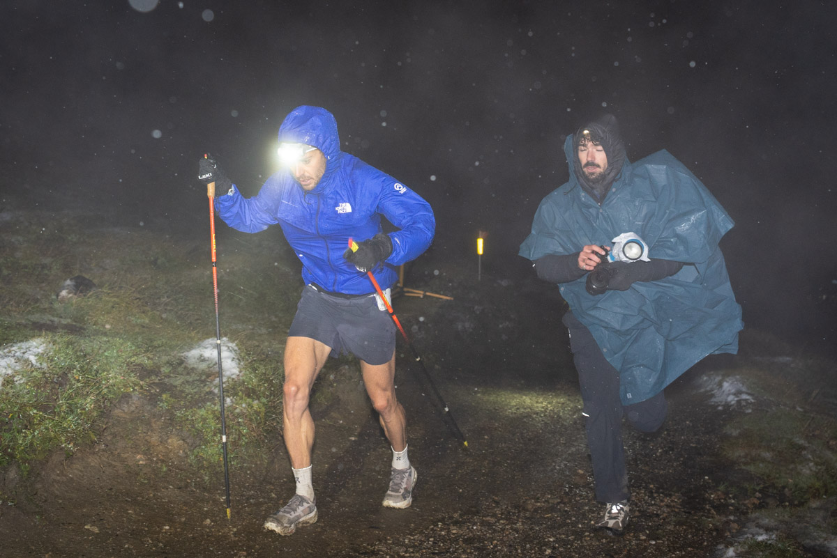 Pro runner Germain Granger wearing performance rain gear during a UTMB race.