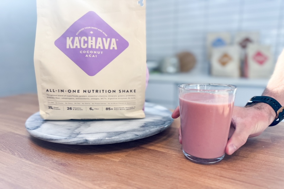 A glass of creamy protein shake with a thick texture, illustrating a satisfying meal replacement option.