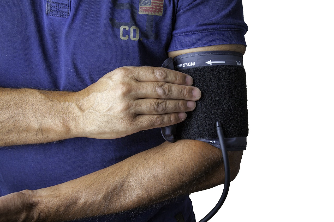 A digital blood pressure monitor and a stethoscope used for clinical checkups.