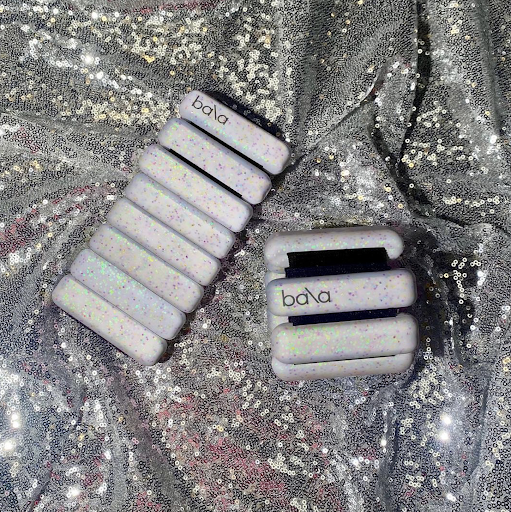Bala Bangles being worn on the wrists during an active workout session.