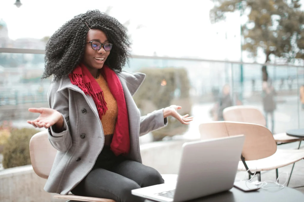 A woman appearing distracted and struggling to focus while someone is talking to her.