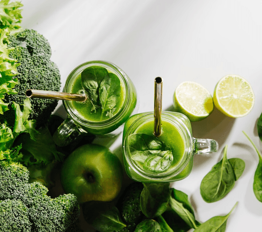 A collection of fresh green vegetables and fruits suitable for a detox preparation diet.