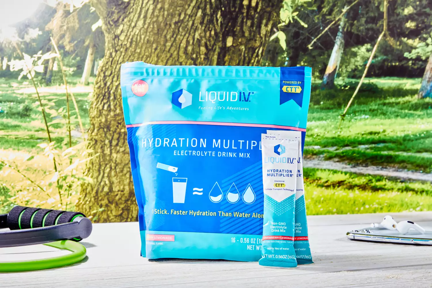Liquid I.V. hydration packets on a table with resistance bands and fitness gear.