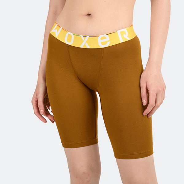 Woman wearing yellow Woxer Biker 9-inch boxer briefs.